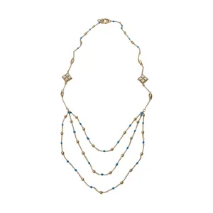 Elegant gold layered necklace featuring blue beads and zircon diamond tassel pendants