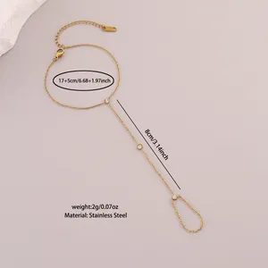 Detail view of gold stainless steel slave bracelet with white cubic zirconia accents