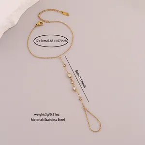 Detail view showing dimensions of stainless steel finger bracelet with white crystals.