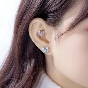 Elegant Y2K style winged heart sword stud earrings with sparkling crystals for women