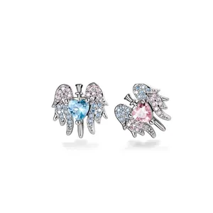 Y2K style winged heart ear studs with pink and blue stones in silver titanium finish