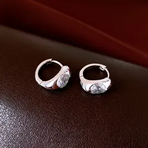 Minimalist 18K gold plated silver hoop earrings featuring sparkling oval cut zircon stones