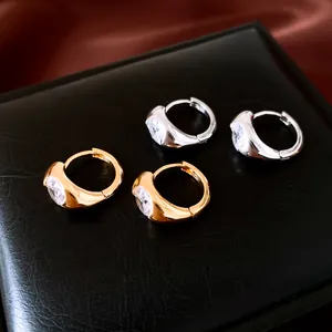 Minimalist 18K gold plated zircon hoop earrings set displayed on black jewelry box.