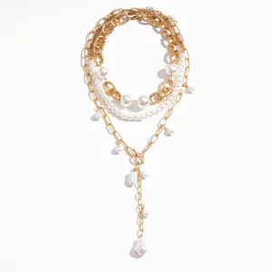 Elegante meerlaagse gouden ketting in vintage stijl met parels en OT-knevelsluiting