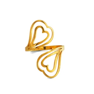 Bague ajustable élégante en forme de double cœur évidé doré pour une femme moderne