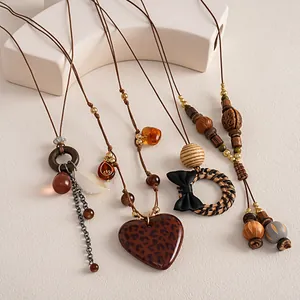 Detailed view of retro bohemian necklaces with leopard heart and rattan charms