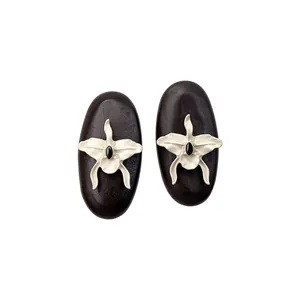 Elegant vintage oval wood stud earrings with white orchid and black gem center