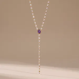 Close-up of elegant geometric zircon Y-shaped stainless steel necklace with purple stone