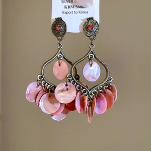 Vintage boho shell tassel earrings with pink rhinestones and bronze teardrop frame
