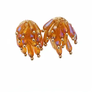 Elegant gold-toned fringe stud earrings with amber faceted glass droplets for women
