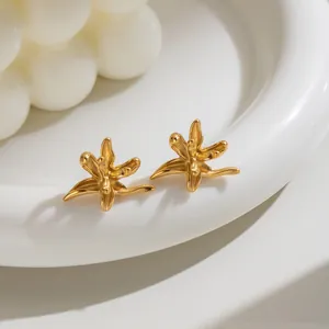 Close-up of 18K gold plated stainless steel firework stud earrings in minimalist style