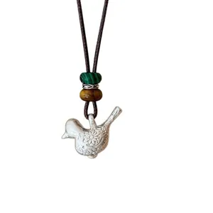 Collier pendentif oiseau fait main avec perles de malachite et œil de tigre