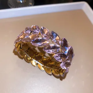 Detailed view of pink marquise crystal wheat ear stretch bracelet in gold finish