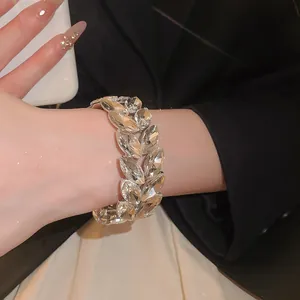 Macro view of a luxurious double-layer wheat ear rhinestone elastic bracelet on wrist