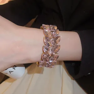 Elegant close-up of pink crystal wheat ear stretch bracelet on a wrist detail view