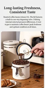 Detailed view of white stainless steel coffee bean canister with metal measuring spoon