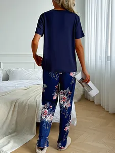 Back view of women's navy blue t-shirt and floral print pajama pants set