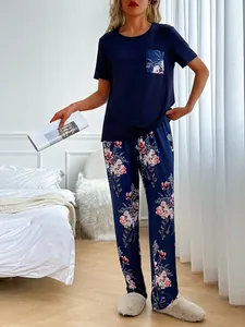 Full view of women's floral pajama set with navy blue short sleeve T-shirt and pants