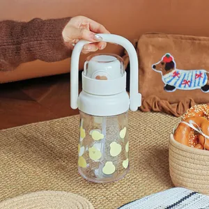 Detail view of a large capacity portable water bottle with a handle and cute pear pattern