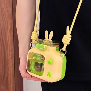 Cute yellow and green camera shaped water bottle with bunny ears and crossbody strap for kids