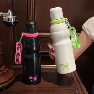 Detailed view of white and black stainless steel sports water bottles with straps