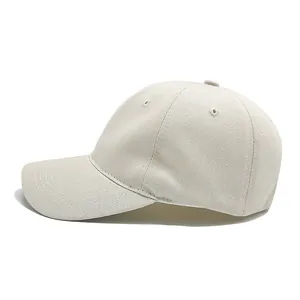 Side profile of a minimalist beige soft-top cotton baseball cap showing fabric detail