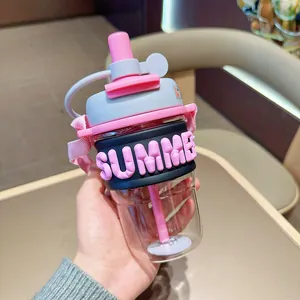 Detail view of stylish pink and grey water bottle with 3D SUMMER sleeve and strap