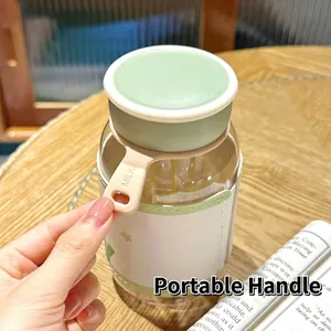 Close-up of the portable silicone handle on a small green water bottle with sleeve
