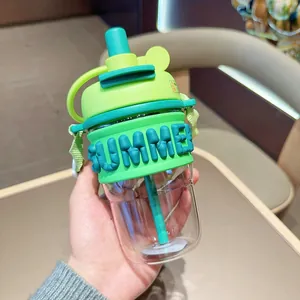 Close-up of portable plastic water bottle with straw and 'SUMMER' embossed sleeve