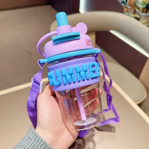 Handheld trendy purple straw water bottle featuring a 'SUMMER' silicone sleeve and strap.