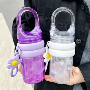 Portable plastic water bottles with integrated handles and flower charms for outdoor travel