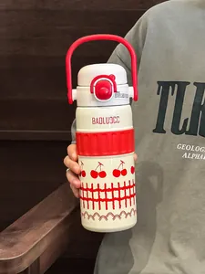 Detail view of a 316 stainless steel insulated water bottle with cherry pattern