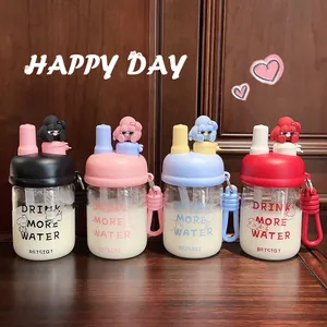 Collection of four colorful cartoon doll glass water bottles with straws.