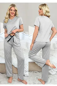 Front and back detail of grey V-neck women's loungewear set in a bedroom setting
