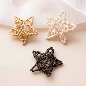 Handmade woven rattan stars in coffee, white, and beige for home decoration props