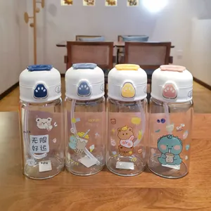 Cute cartoon glass water bottles with cat paw pop-up lids and reusable straws.