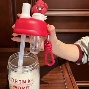 Close-up of dual-drinking lid with tea infuser and a stylish red cartoon figurine on top