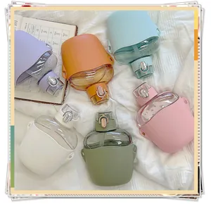 Selection of colorful minimalist plastic water bottles featuring protective sleeves and flip-top lids