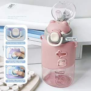 Pink portable kids water bottle with dual-drink straw and bear lid for school