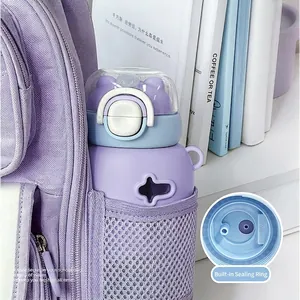 Portable leak-proof children's straw water bottle in purple schoolbag, student drinkware