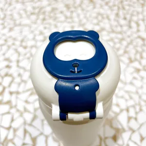 Close-up detail of a blue cartoon bear clasp on the flip lid of a cute glass water cup