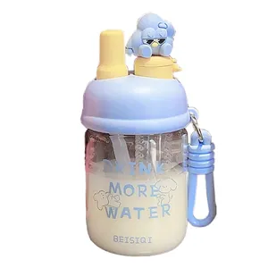 Creative dual-drink glass water bottle with cute cartoon figurine and integrated straw