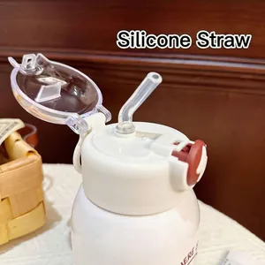 Close-up detail of the transparent silicone straw and flip-top lid of water bottle