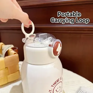 Detail view of the portable carry ring on white insulated stainless steel bottle
