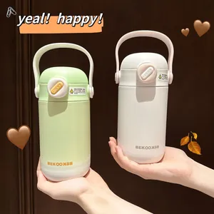 Close-up of portable insulated water bottles with matte finish and convenient handles.