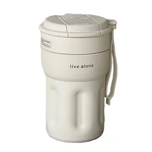 Minimalist cream-colored portable insulated coffee cup with hand strap and straw lid