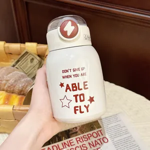Close-up of white insulated straw water bottle with red English inspirational text