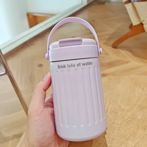 Detailed close-up of a lavender stainless steel travel water cup with a carrying handle