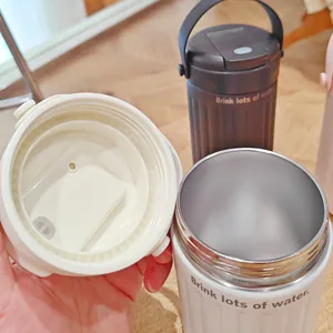 Detailed view of the stainless steel interior and dual-drinking lid of the water bottle
