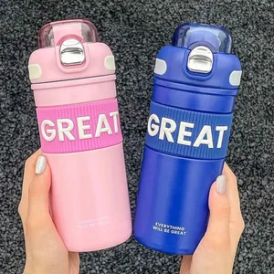 Couple's set of vibrant pink and blue insulated water bottles with pop-up straw lids